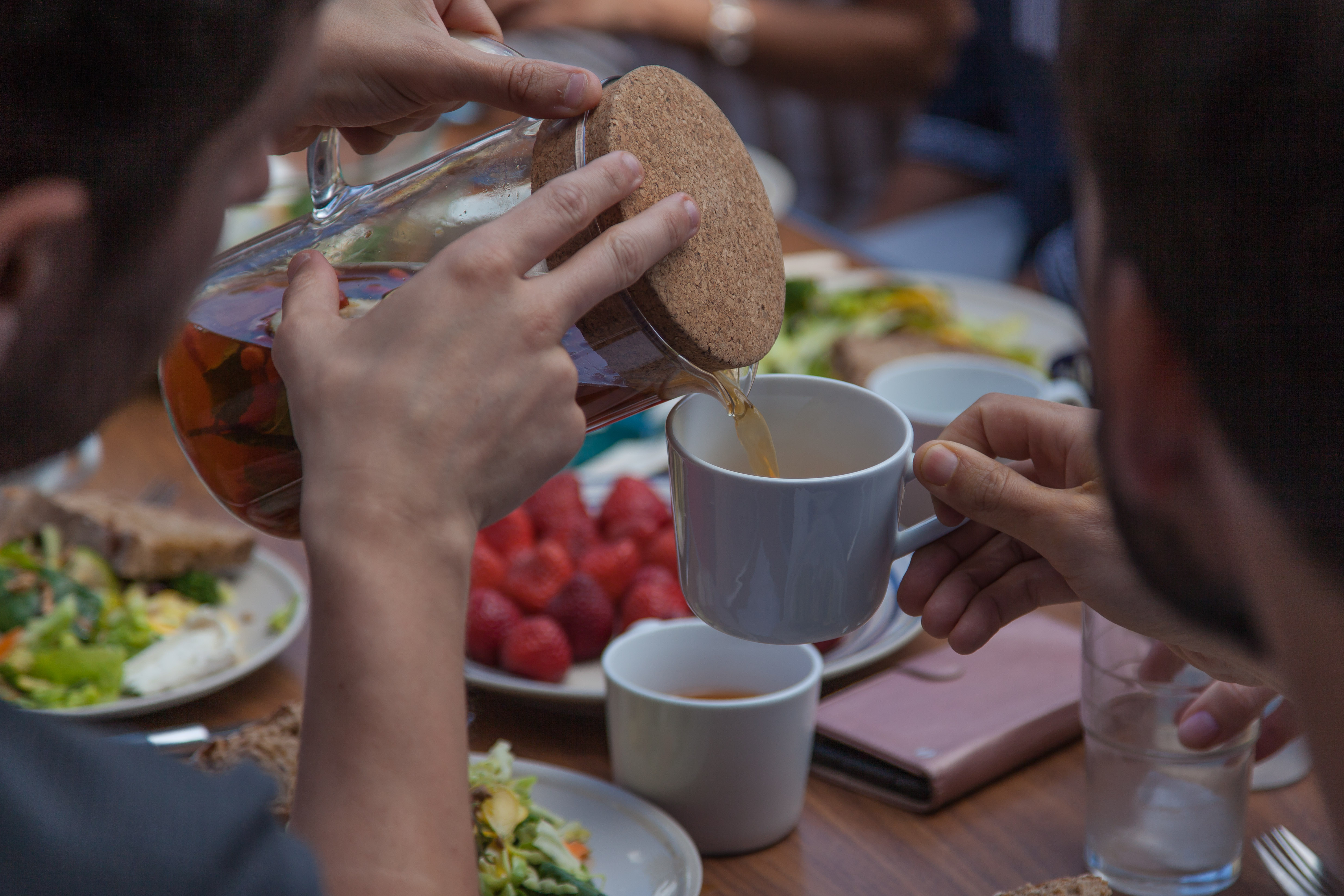 Pouring tea with cork jug